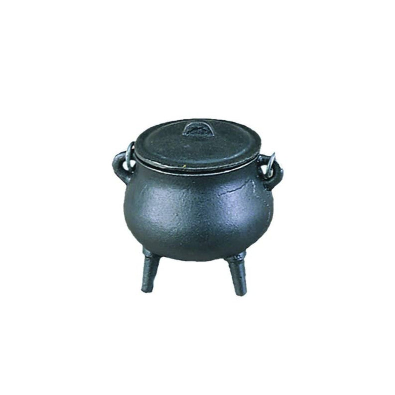 Black cast iron pot with lid on a white background