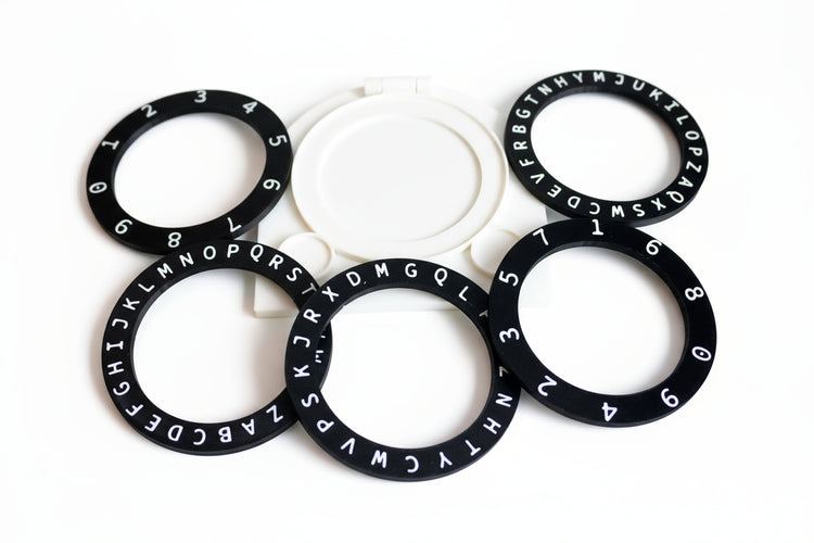 Black rings with letters and numbers on a white background