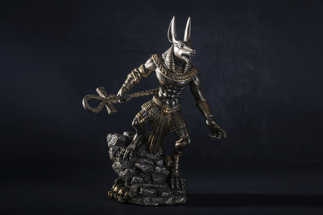 Statue of a Egyptian deity with a dark background