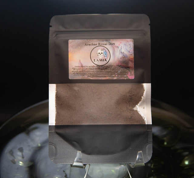 Black packaging with a label featuring text and graphics on a dark background