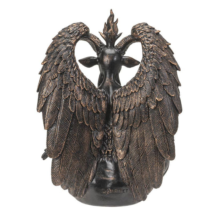 Bronze statue of a creature with wings on a white background