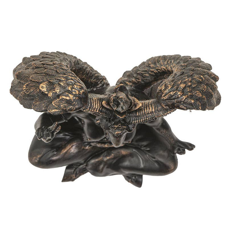 Decorative ram's head sculpture on a white background