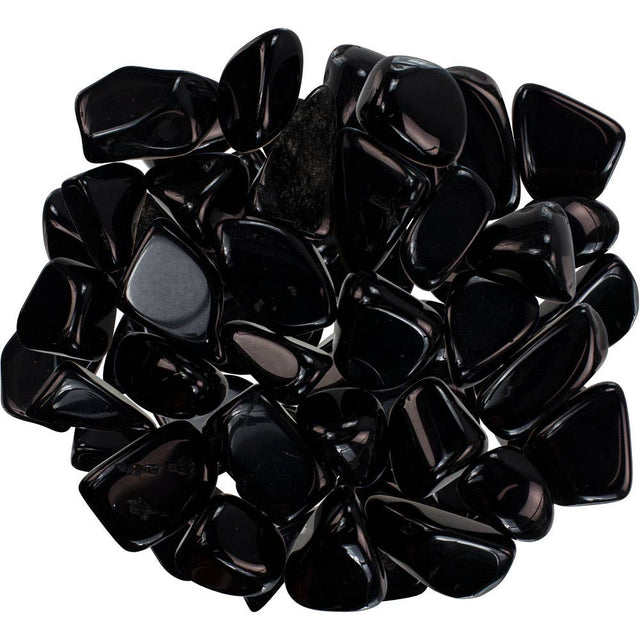 Black pebbles on a white background its black obsidian