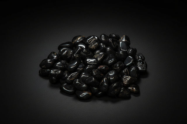 Pile of black stones on a white background