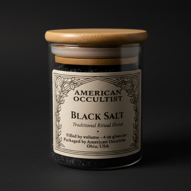 Black granular ritual salt blend in a labeled glass ritual jar