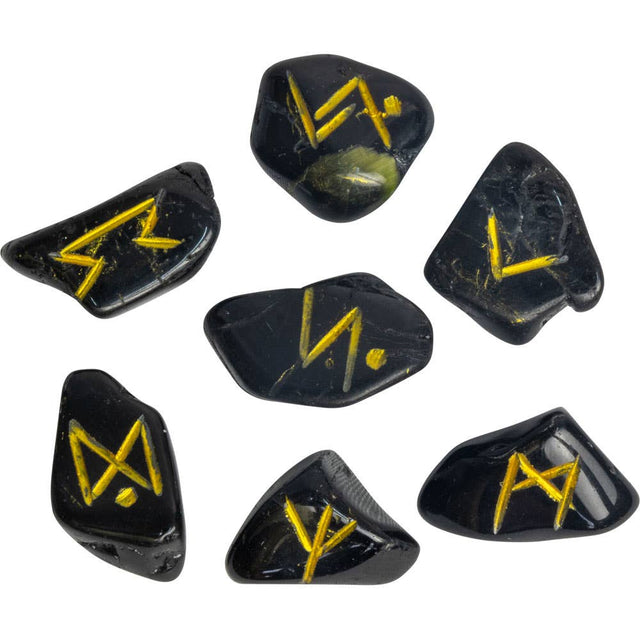 Set of black dice with yellow symbols on a white background