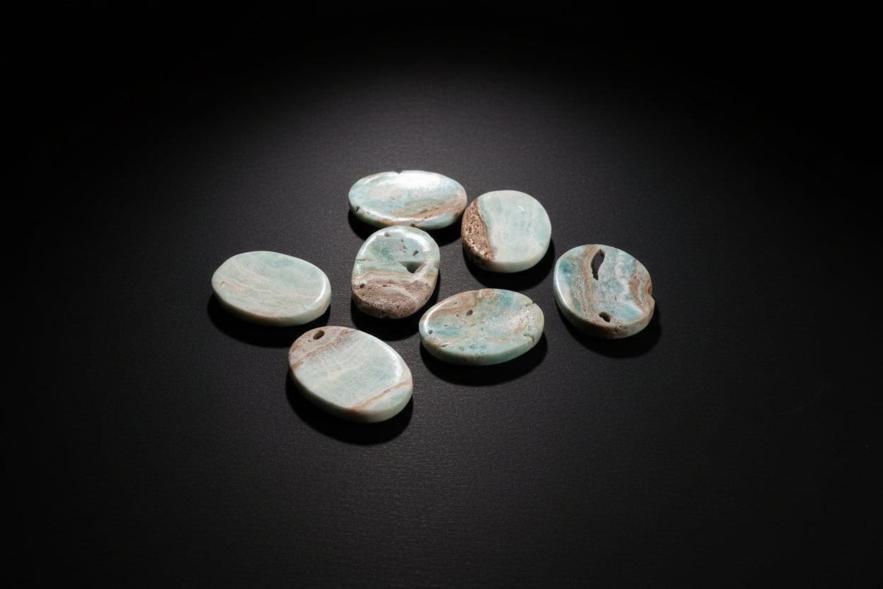 Polished pale-blue to blue-green Aragonite worry stone