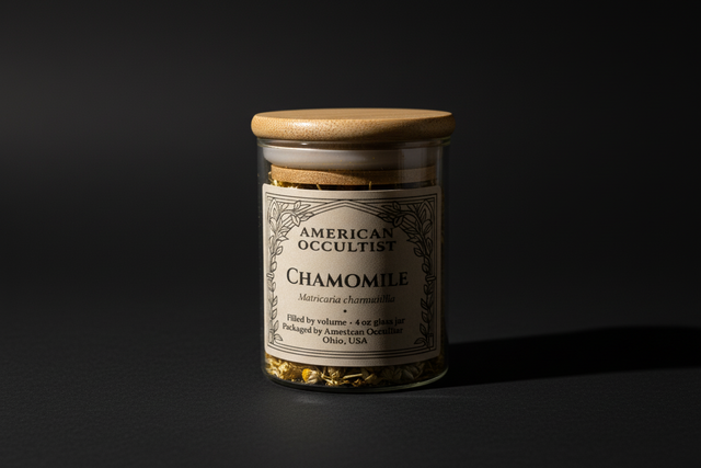 Jar of chamomile flowers with a wooden lid on a white background