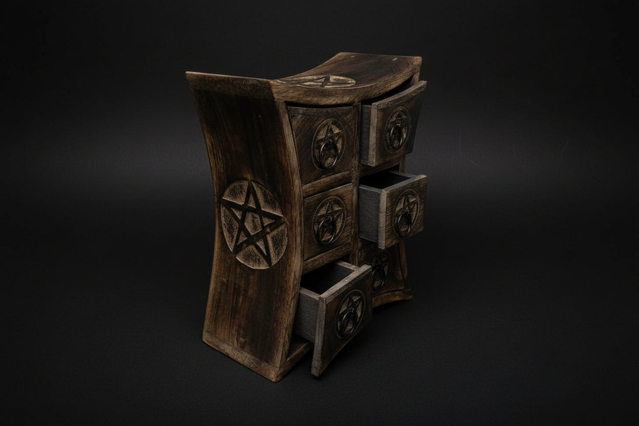 Wooden dresser with pentagram designs on a white background