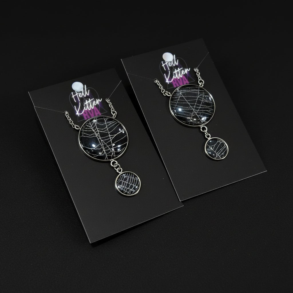 Double moon necklace containing real spiderweb