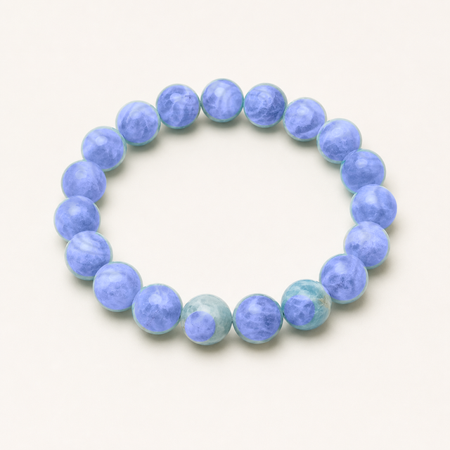 Faceted sodalite beaded stretch bracelet with deep blue stone and natural white mottling.