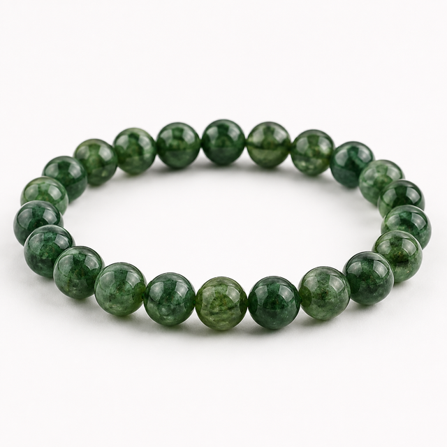 Green Tourmaline beaded stretch bracelet with polished forest green gemstone beads on a white background