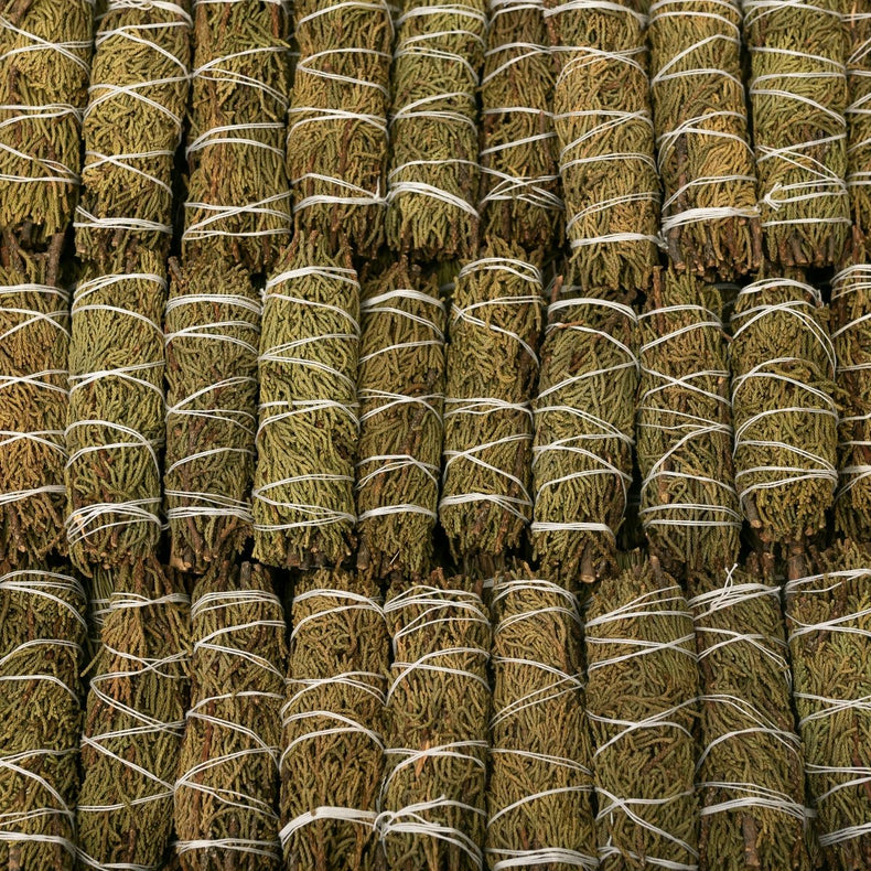 Bundles of dried herbs tied together in a pattern
