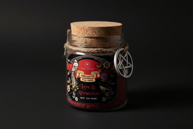 Glass jar with cork lid labeled 'Love & Attraction' on a white background