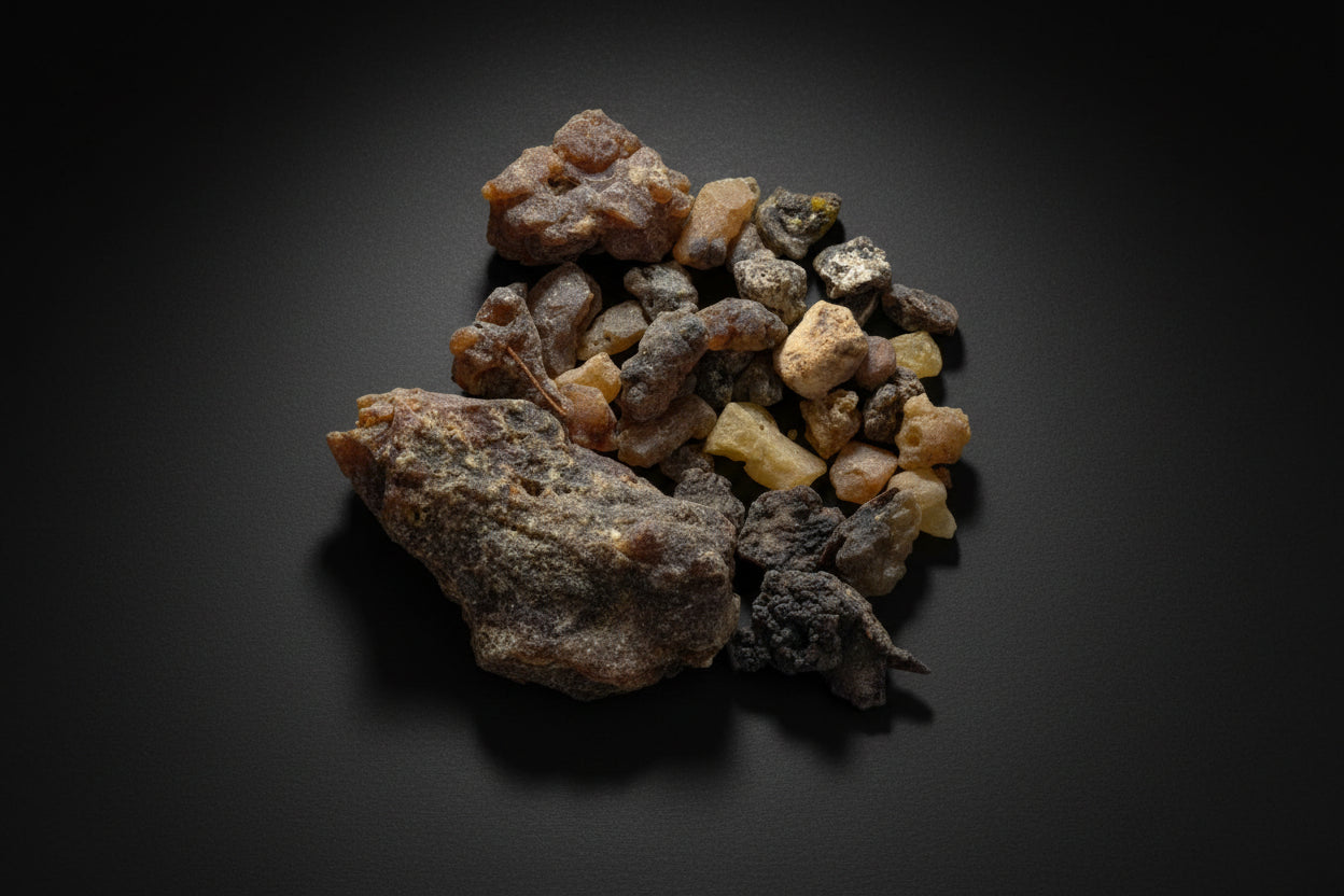 Collection of various colors of palo santo resin on a white background