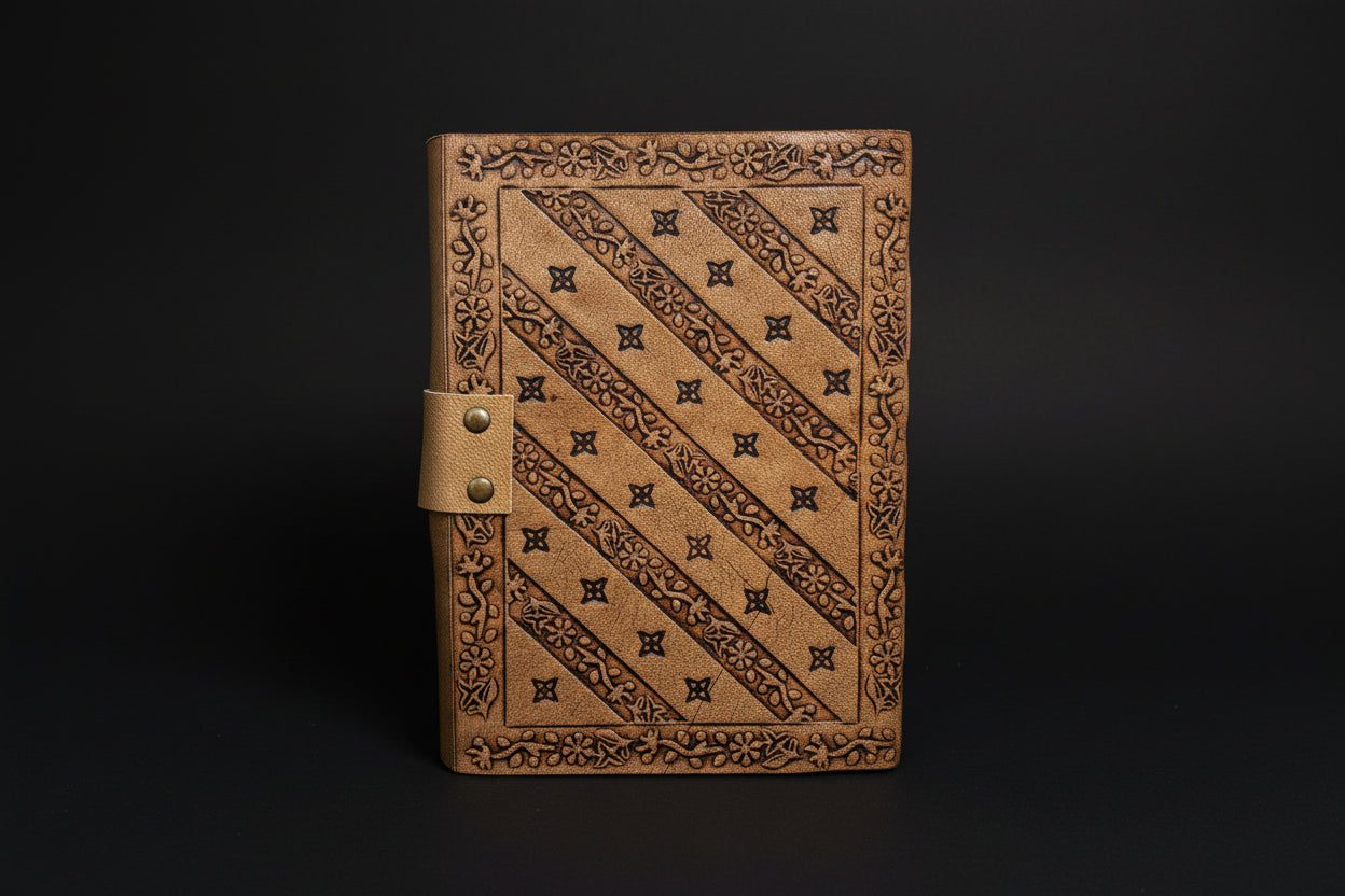 Pentagram broom leather journal shown open with deckle-edge pages