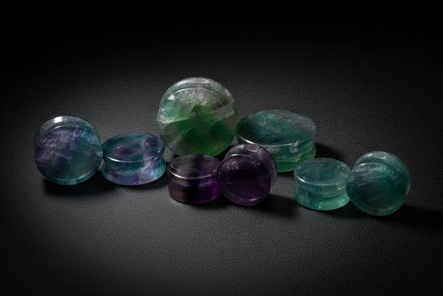 Set of multicolored gemstones on a white background