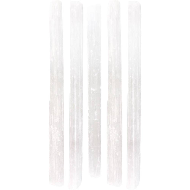 White vertical selenite wands on a white background