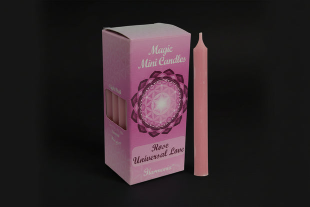 Rose-scented pink chime candle in retail packaging on a white background