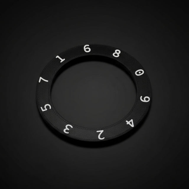 Black ring with numbers on a wooden surface