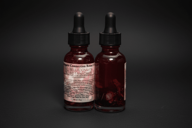 2 bottles of oil for connections in love and relationships on a black background.