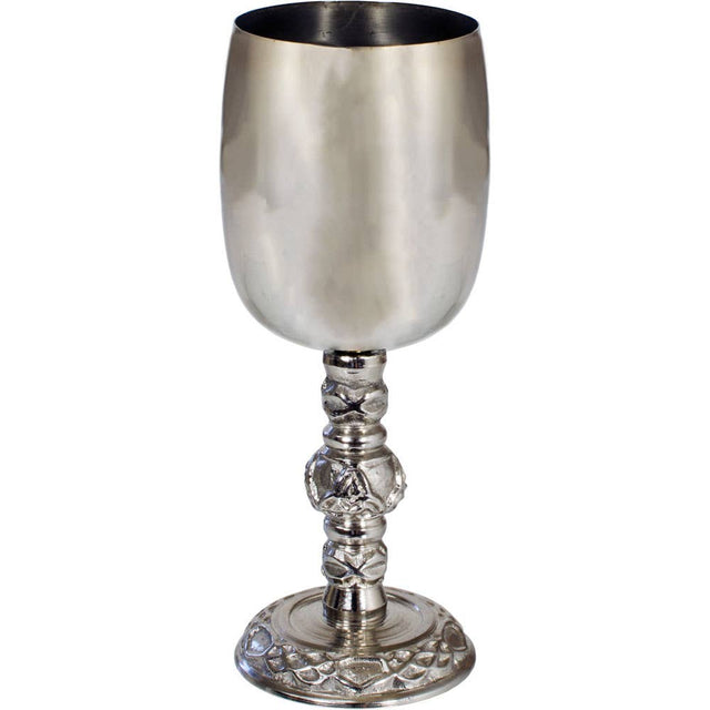 Silver goblet with intricate design on a white background