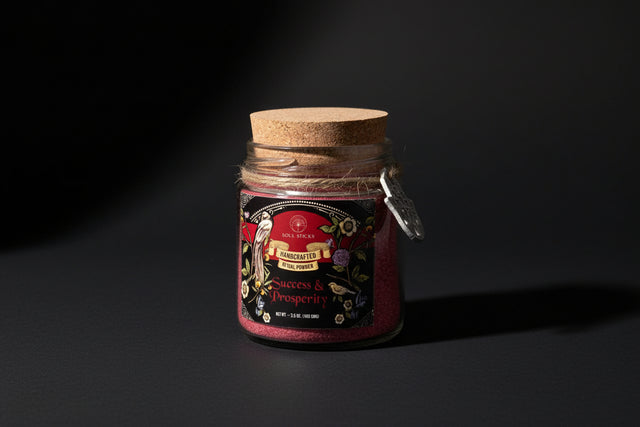 Jar of 'Success & Prosperity' powder with decorative label on a white background