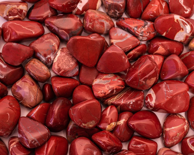 Close-up of red stones with a focus on texture and color.