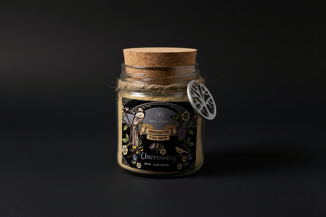 Glass jar with a ritual powder and cork lid and decorative label on a white background