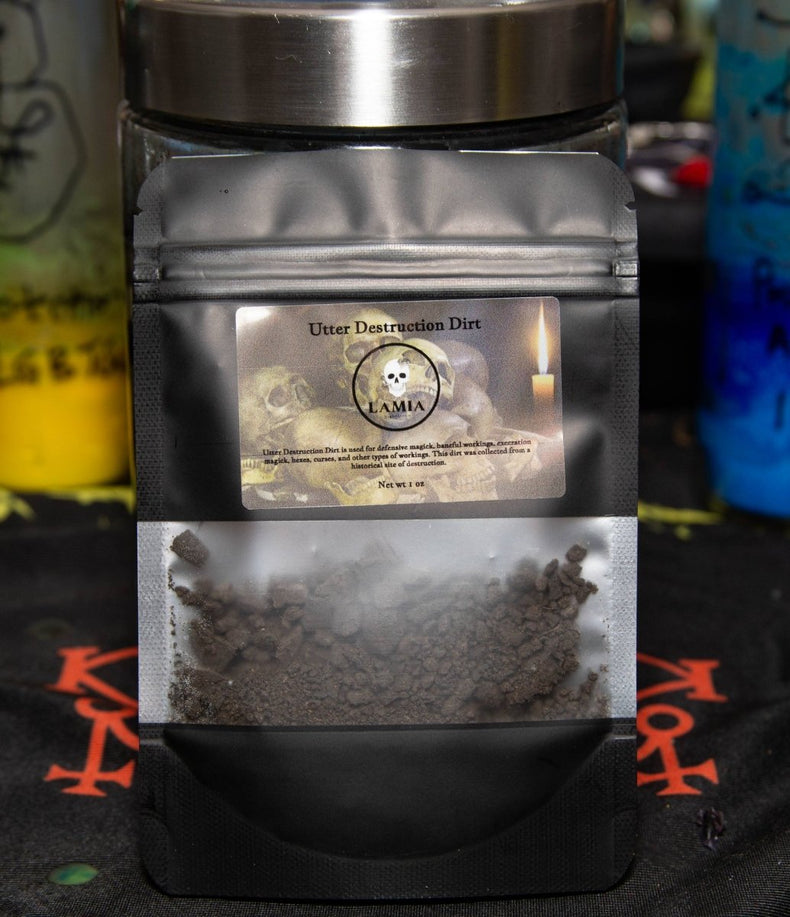 Container of 'Utter Destruction Dirt' with a visible label on a dark background