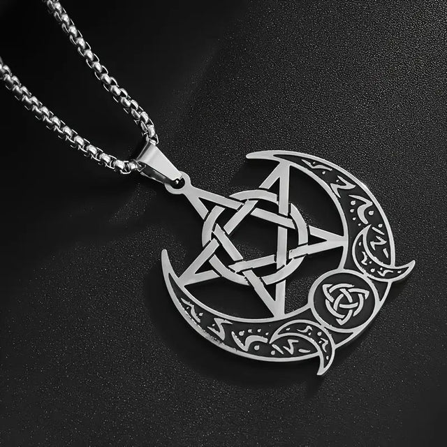 Silver pentacle and crescent moon pendant on a black background