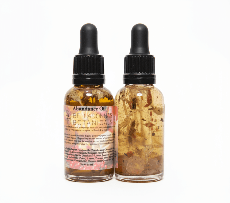 Two glass bottles with droppers labeled 'Abundance Oil' from Belladonna Botanicals on a white background.