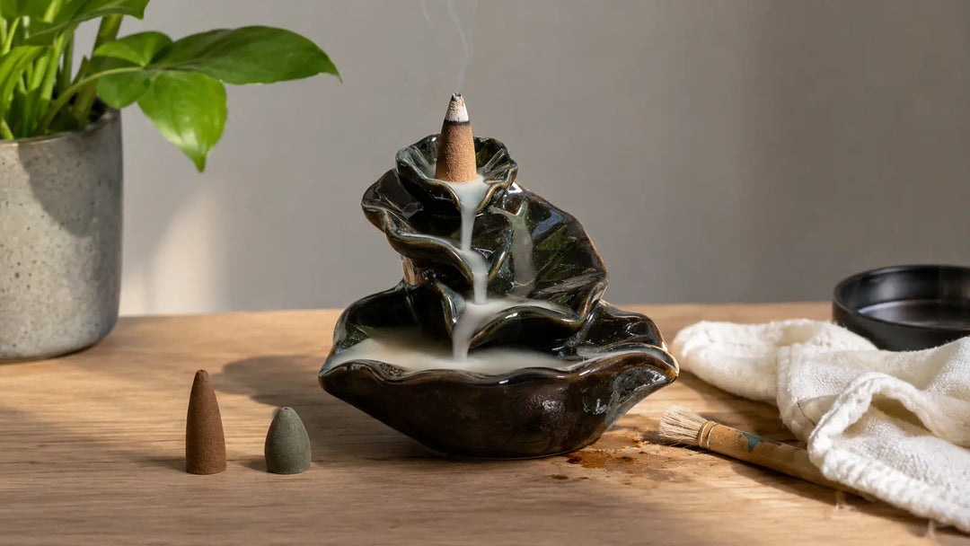 Ceramic backflow incense burner with two cone types, cleaning brush, and cloth for troubleshooting smoke flow and residue