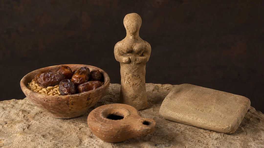 Clay deity figurine, grain and date offering bowl, oil lamp, and blank tablet representing Canaanite household practice