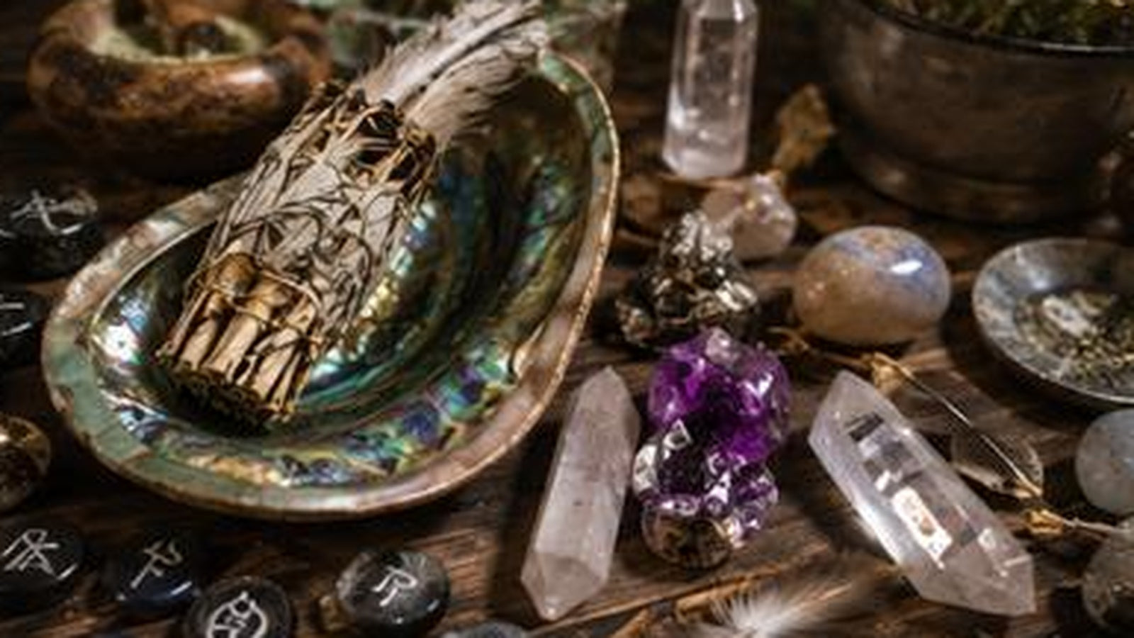Ritual tools, herbs, ash, candles, and crystals arranged for careful cleanup after a working.