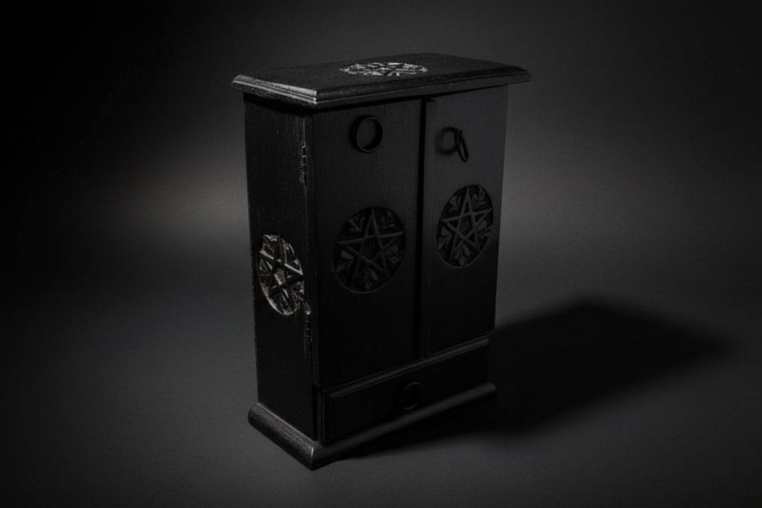 Black pentacle wooden cupboard representing altar boxes and ritual storage