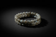 Labradorite beaded bracelet with gray stones and iridescent flash
