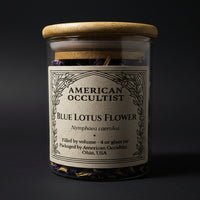 Dried blue lotus flower (Nymphaea nouchali var. caerulea) in a labeled glass ritual herb jar