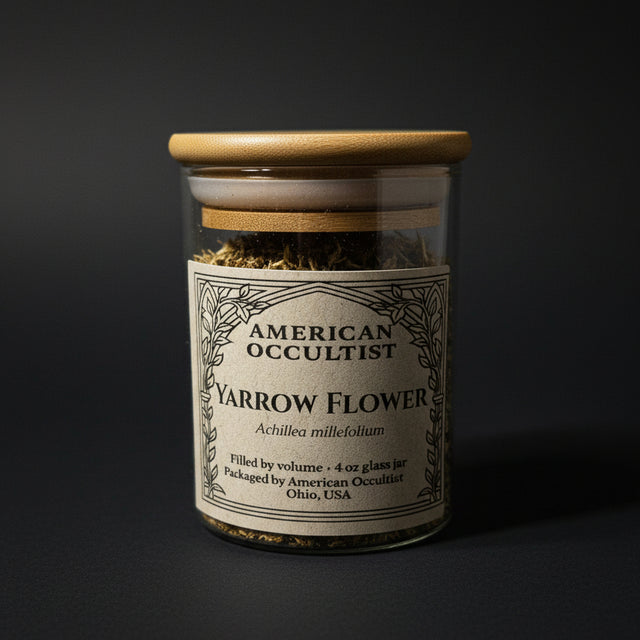 Jar of American Occultist Yarrow Flower on a marble surface