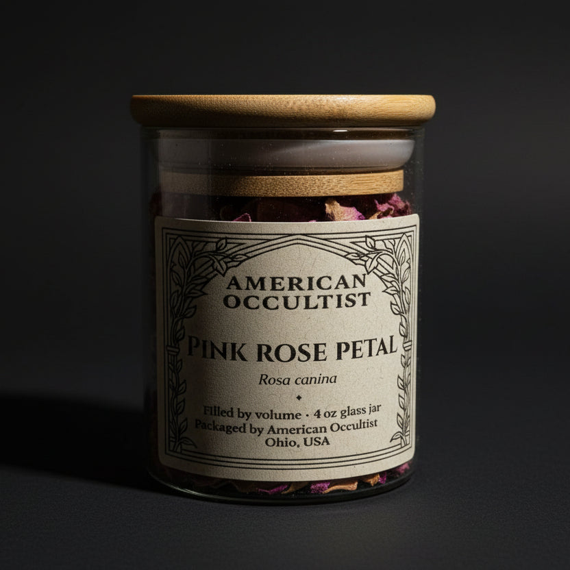 Dried pink rose petals (Rosa canina) in a labeled glass ritual herb jar