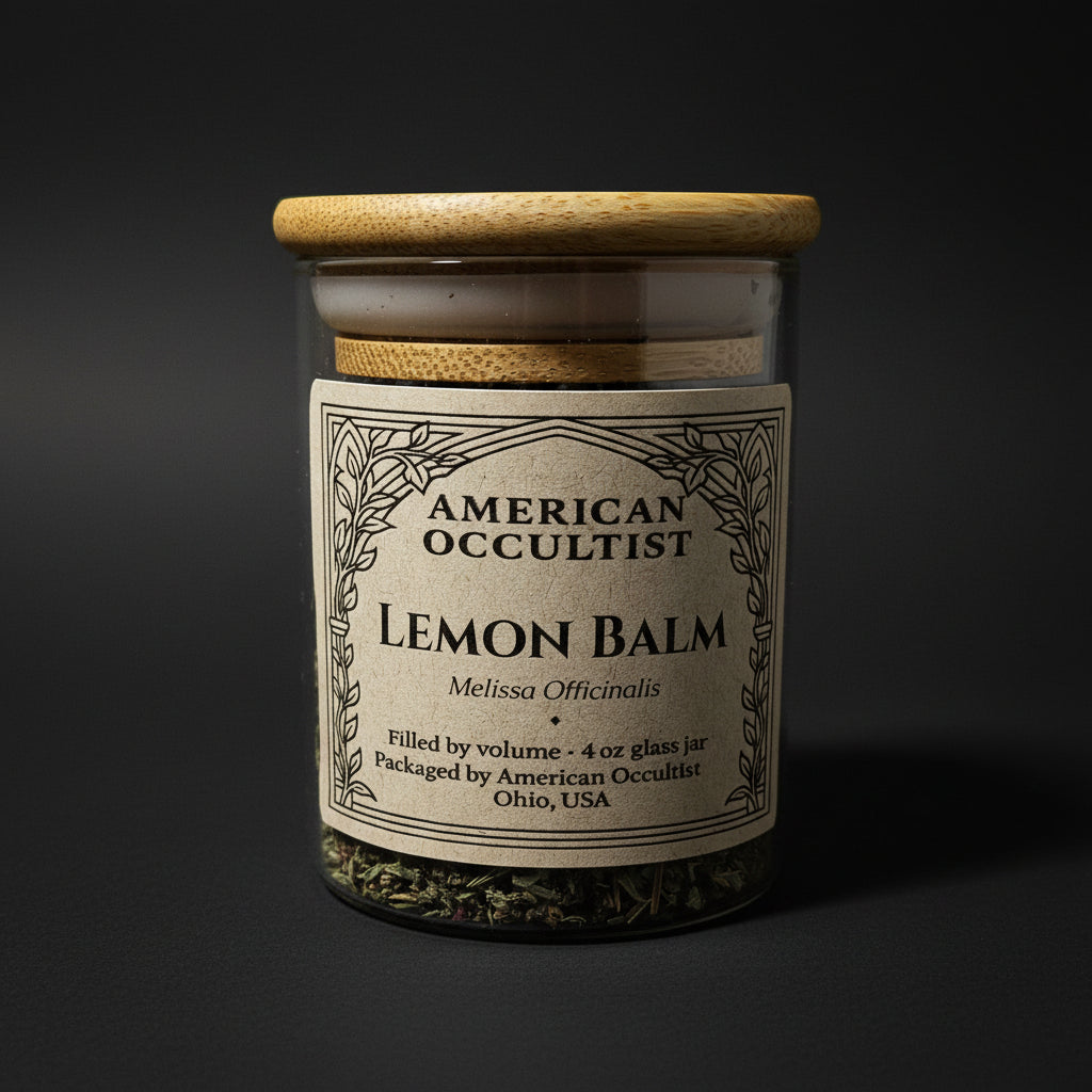 Dried lemon balm (Melissa officinalis) in a labeled glass ritual herb jar