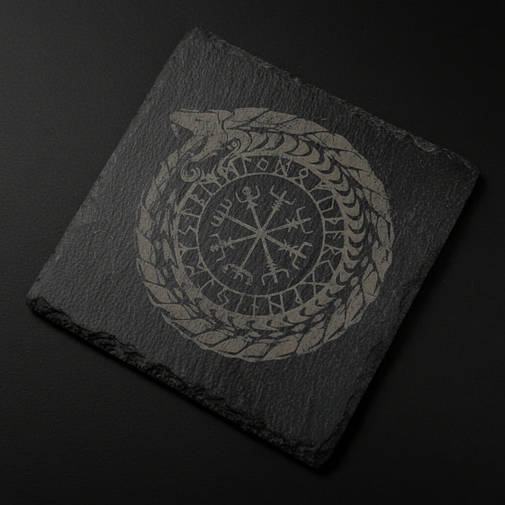 square slate altar tile engraved with Nordic ouroboros and runic-style symbol used as a ritual surface.