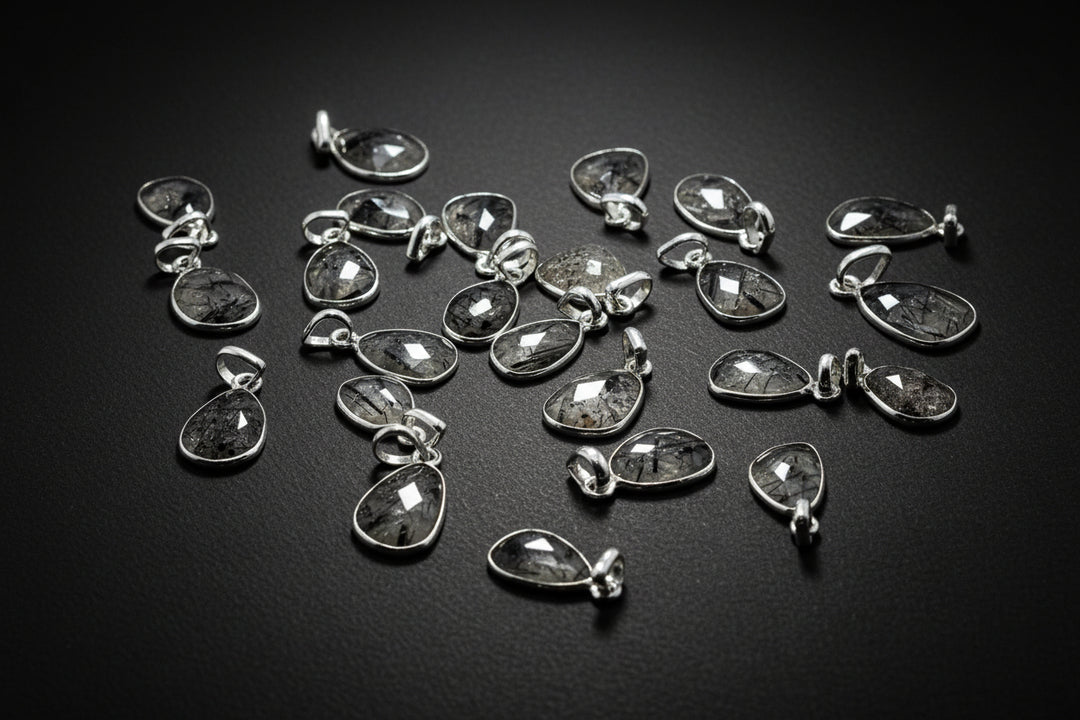 Faceted Black Rutilated Quartz pendant in a silver setting