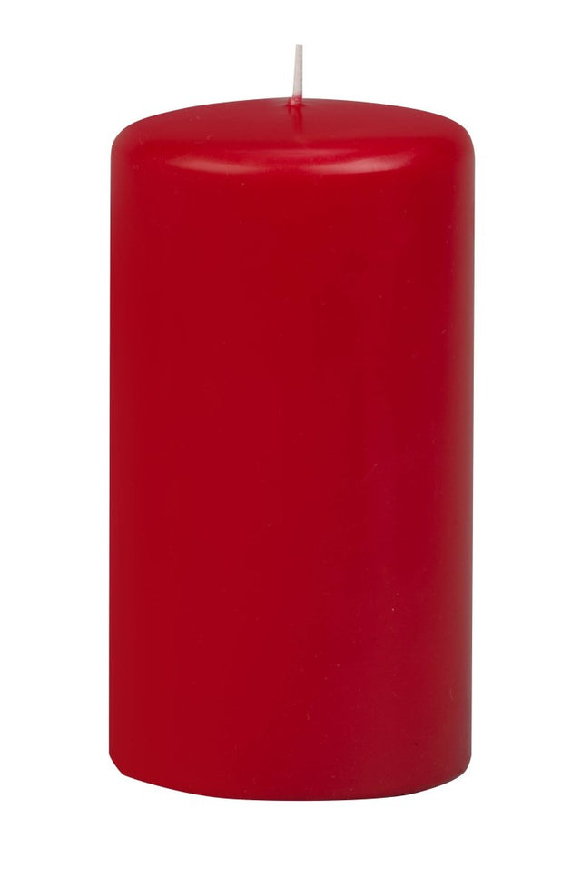Red candle on a white background