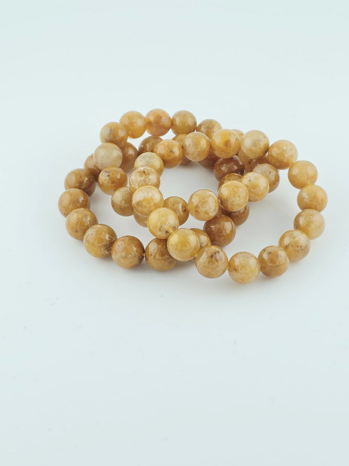 Yellow Rabbit Fur beaded bracelet with polished yellow-toned stone beads