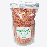 Bag of pink rose petals with a label on a white background