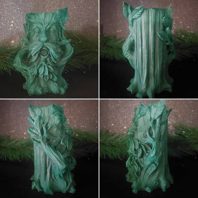 Green leafy decorative item against a dark background with greenery.