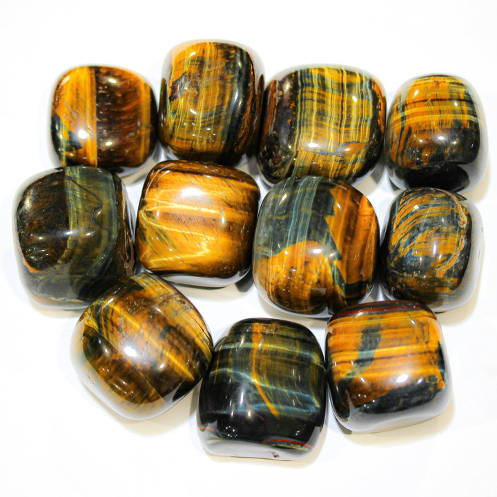 Assortment of polished Blue Tiger Eye stones with chatoyant banding