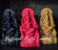 Three candle sculptures in black, red, and gold with 'Mystical Mysti Candles' branding.