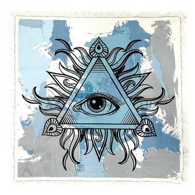 Decorative altar cloth with eye and triangle design on a blue and gray abstract background